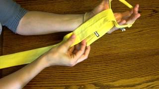 How to tie a childrens necktie [upl. by Ynnatirb]